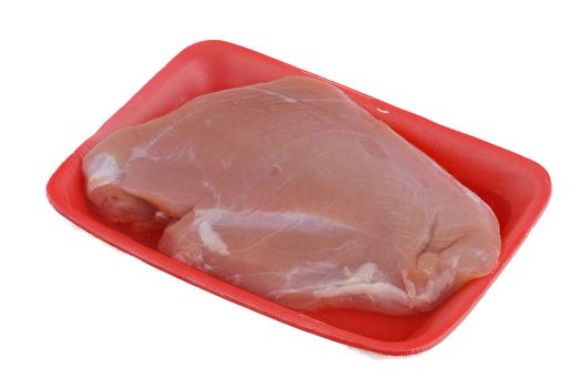 Raw turkey breast Raw turkey breast on orange foam meat tray isolated on white background