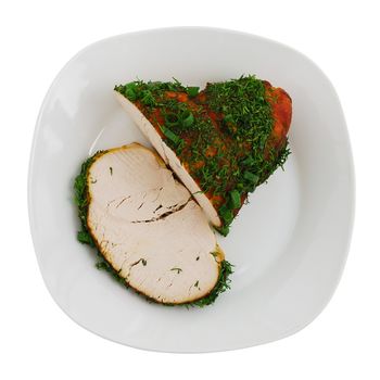 Sliced roasted turkey breast on plate isolated on white background