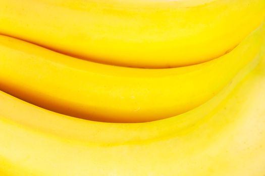 Closeup view of a bunch of yellow ripe bananas
