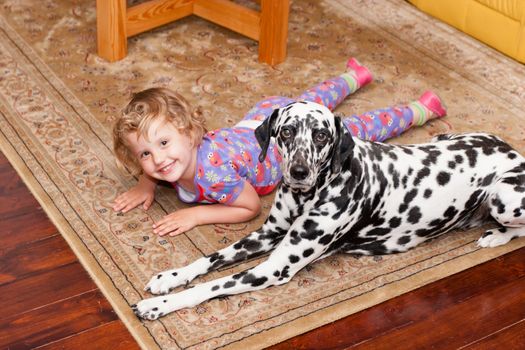 Two pals playing on the carpet together.