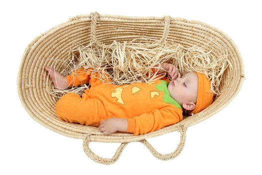 Baby boy wearing a pumpkin costume sleeping