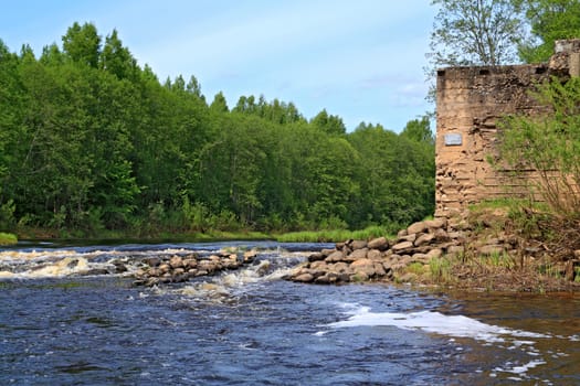 aging destroyed dam on small river