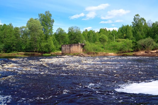 aging destroyed dam on small river