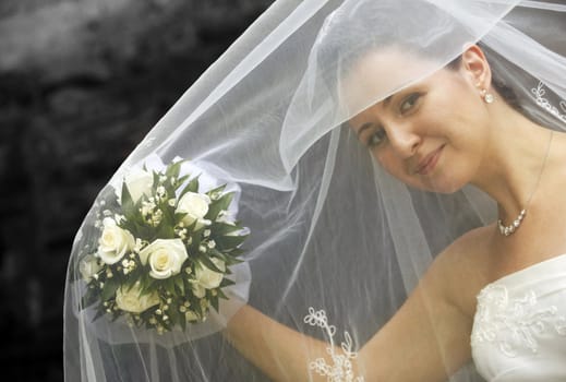 The beautiful bride on a green background