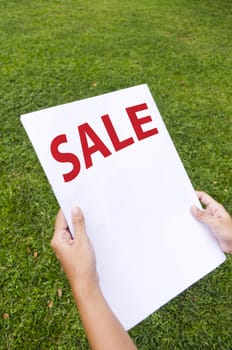 woman is reading a page with sale news