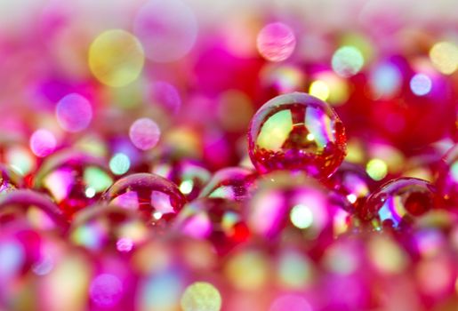 red bead in close up view with bokeh back and foreground