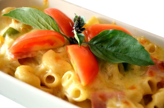 a delicious macaroni with cheese and tomato