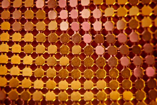 Orange sequins abstract close up background.