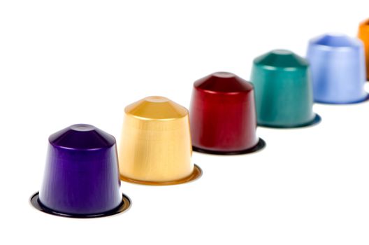 Coffee capsules for a coffee machine, close up view isolated on white background.
