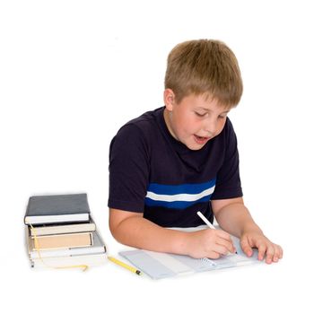 a young boy studying his homework