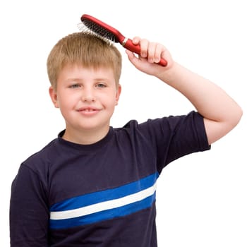 boy combs the hair on a white background