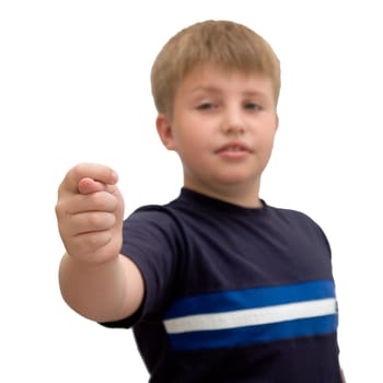 little boy shows a fig on a white background