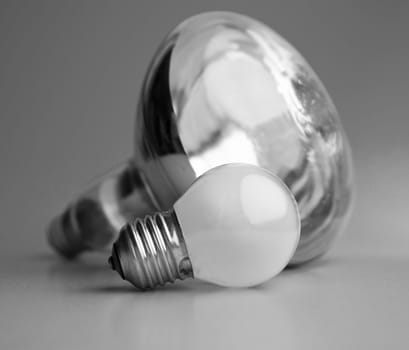Greater and small electric bulbs. Black and white.