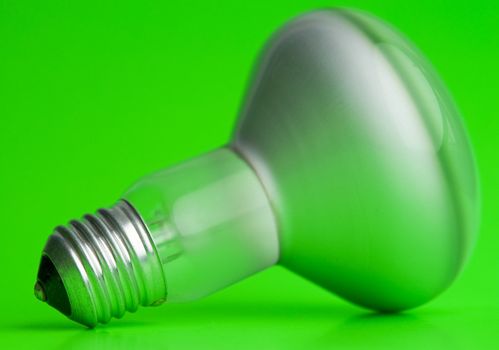 the electric bulb on a green background