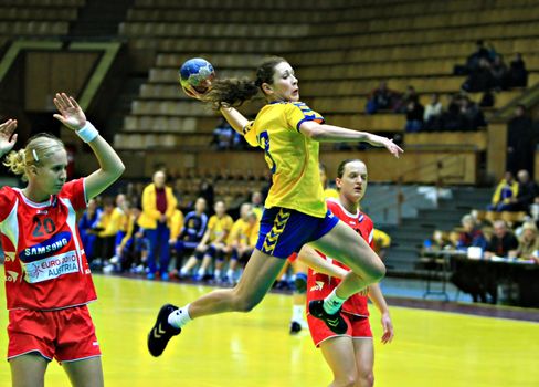 Handball player jumping with the ball. A high point of the match between Ukrainian and Austrian handball teams within the Turchynov Cup International Handball Tournament for women handball players in Kyiv November 23, 2007