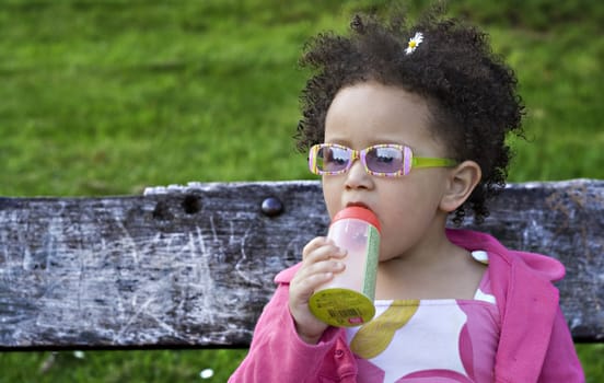 Young black baby girl with glasses