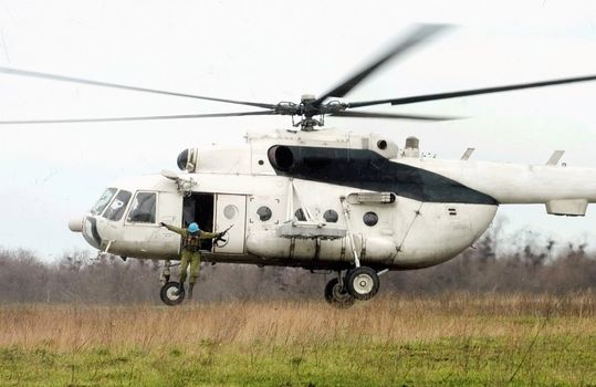 paratroopers  jump from helicopter 