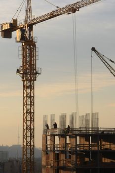 �onstruction activity. Silhouette of construction worker