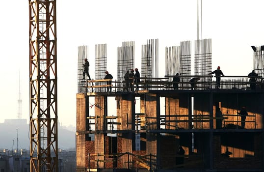 �onstruction activity. Silhouette of construction worker