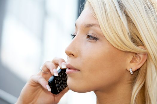 Businesswoman using mobile phone