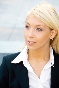 Young businesswoman with pensive expression