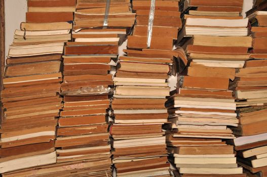 A pile of old, worn books