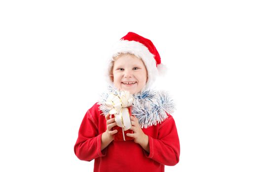 child in Santas cap with present