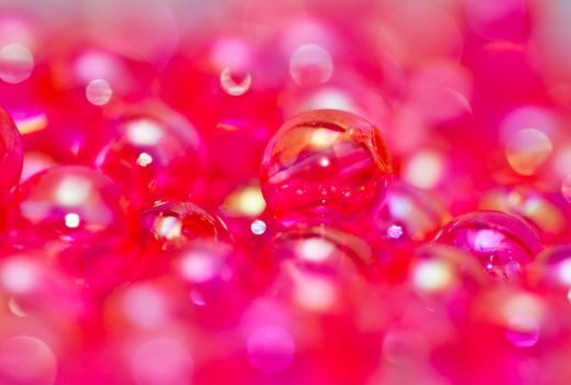 red beads abstract background in close up view landscape orientation