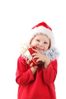child in Santas cap with present