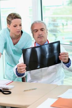 Doctor and nurse examining an xray