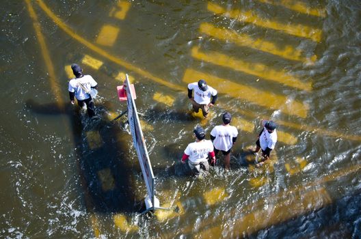 BANGKOK THAILAND – NOVEMBER 13 : the victims of flood waiting for higher vehicle in Phahon Yothin Road November 13, 2011 in Bangkok, Thailand.