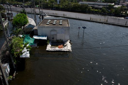 BANGKOK THAILAND – NOVEMBER 13: Scenes The Siam Commercial Bank, Limited in Bangkok during its worst flooding in decades is a major disaster on November 13, 2011 in Bangkok, Thailand.