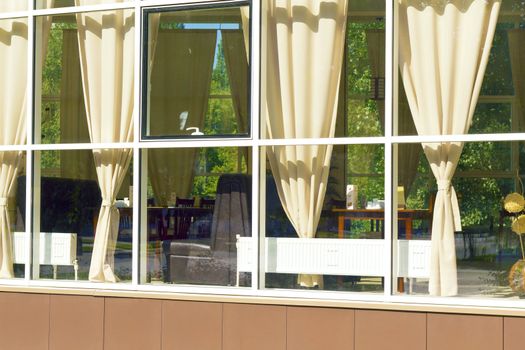 view from the street through a window at the interior of the cafe