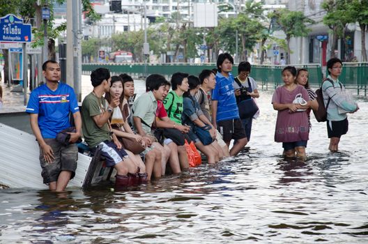 BANGKOK THAILAND – NOVEMBER 13: People waiting of hight vehicles or boat  during its worst flooding in decades is a major disaster on November 13, 2011 in Bangkok, Thailand.