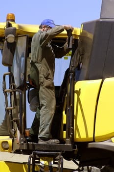 the harvest of colza with machines like a reaping-machine threshing-machine and tractor