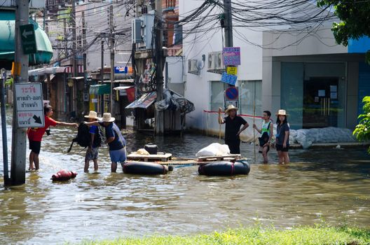 BANGKOK THAILAND – NOVEMBER 13 : the victims of flood waiting for higher vehicle in Phahon Yothin Road November 13, 2011 in Bangkok, Thailand.