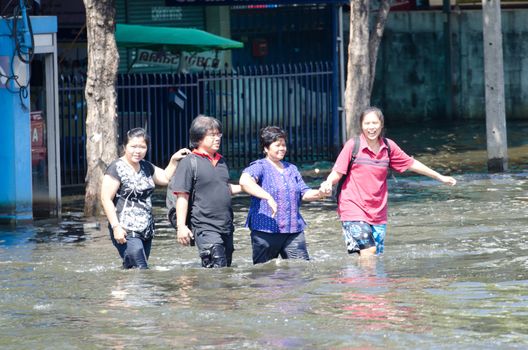 BANGKOK THAILAND – NOVEMBER 13 : the victims of flood waiting for higher vehicle in Phahon Yothin Road November 13, 2011 in Bangkok, Thailand.