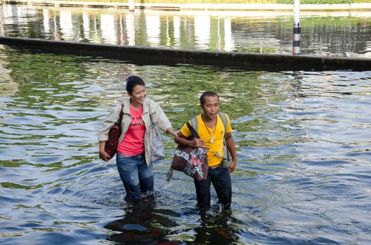 BANGKOK THAILAND – NOVEMBER 13 : the victims of flood waiting for higher vehicle in Phahon Yothin Road November 13, 2011 in Bangkok, Thailand.