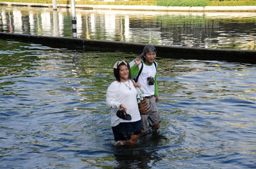 BANGKOK THAILAND – NOVEMBER 13 : the victims of flood waiting for higher vehicle in Phahon Yothin Road November 13, 2011 in Bangkok, Thailand.