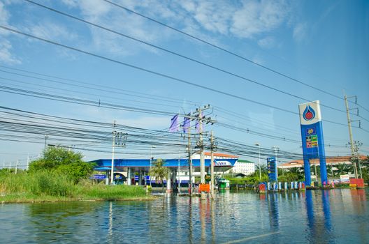 PATHUM THANI THAILAND – NOVEMBER 14: Gas station in Pathum Thani  during its worst flooding in decades is a major disaster on November 14, 2011  in Pathum Thani, Thailand.
