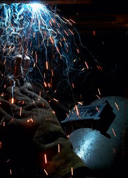 a picture of a welder working at night