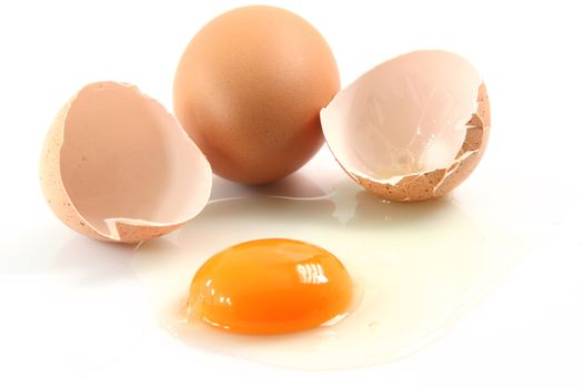 two eggs one is broken food concepts isolated on white background