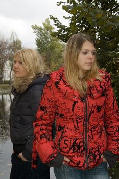 Two young women in a autumn park