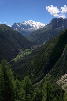 View of Mont Blanc and Bouqui Gorges from the Switzerland side.  Taken from a train that travels from Le Chatelard to Pied du barrage. 
