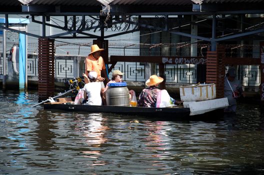 BANGKOK, THAILAND-NOVEMBER 13: Transportation of people in the streets flooded after the heaviest monsoon rain in 50 years in the capital on November 13, 2011 Phahon Yothin Road, bangkok, Thailand.