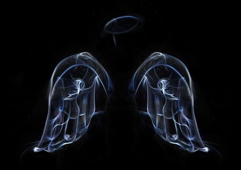 The two wings of angels, and a halo of smoke on a black background