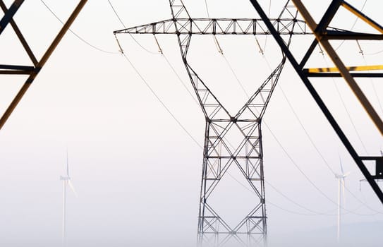 high voltage pylons and windturbines