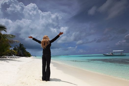 happy  business woman on the desolate ocean coast