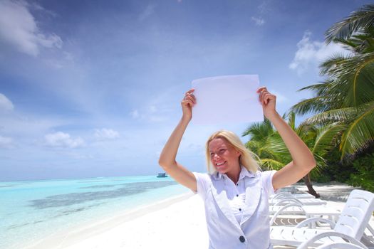 business woman with blank paper on the desolate ocean coast