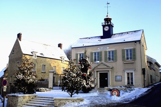 Town hall of Thoiry in winter under snow
